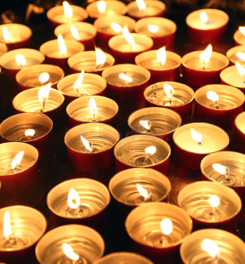 Candles Lit with the Flame during the Religious Ceremony Stock Photo