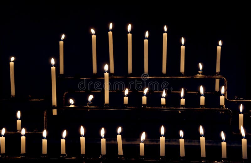 Flames Of Wax Candles During The Eucharistic Celebration In The Stock