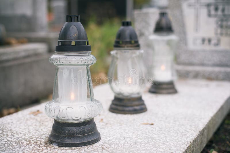 Candles on the graves. stock photo. Image of light, memories 129775520