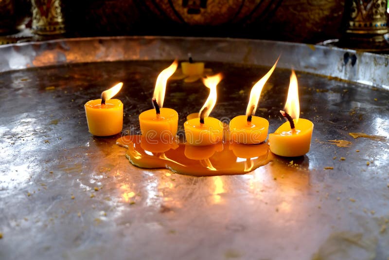Candles on a tray stock photo. Image of asian, candle 56432406
