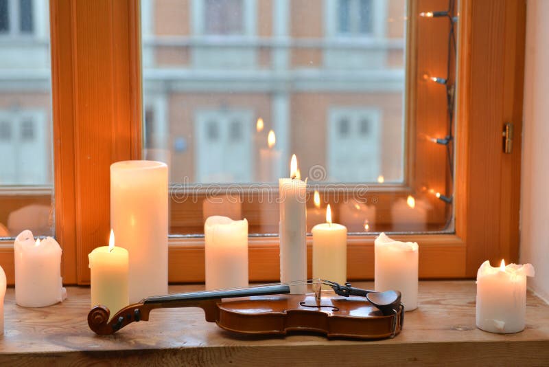 Candles and violin stock photo. Image of glint, group 46434752