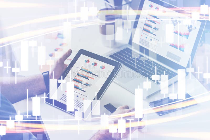 Candlestick chart on foreground. Double exposure. On background close-up of tablet computer with graphs on screen in hands stock photography