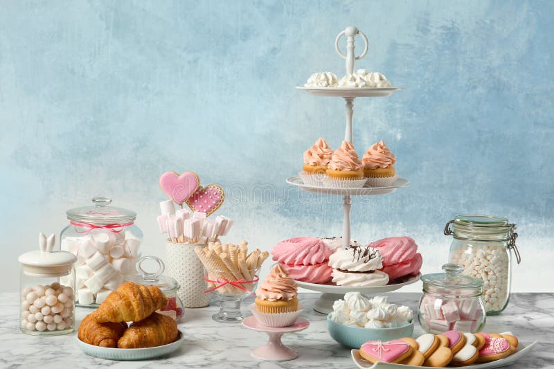 Candy bar with different sweets on white marble table royalty free stock image Candy bar with different sweets on white marble table royalty free stock image