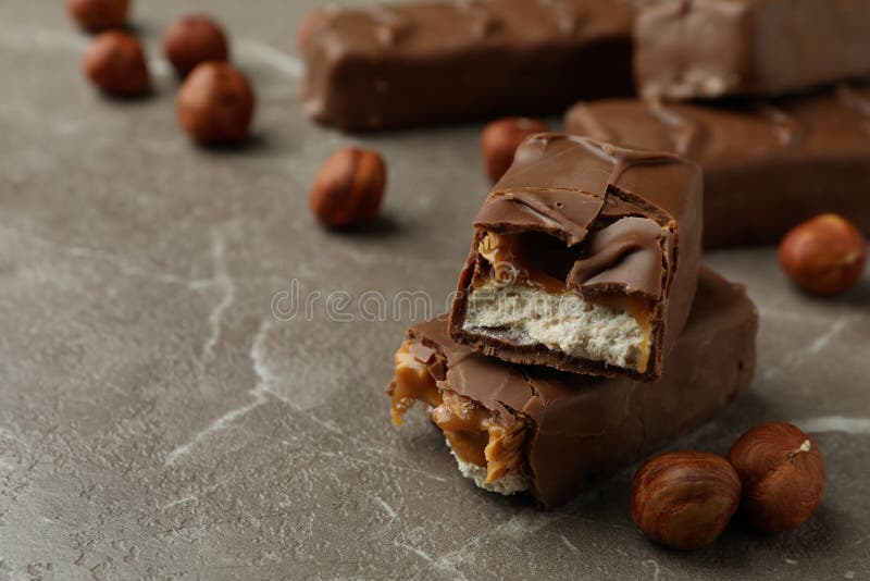 Candy Bars and Nuts on Gray Textured Table Stock Image Image of piece
