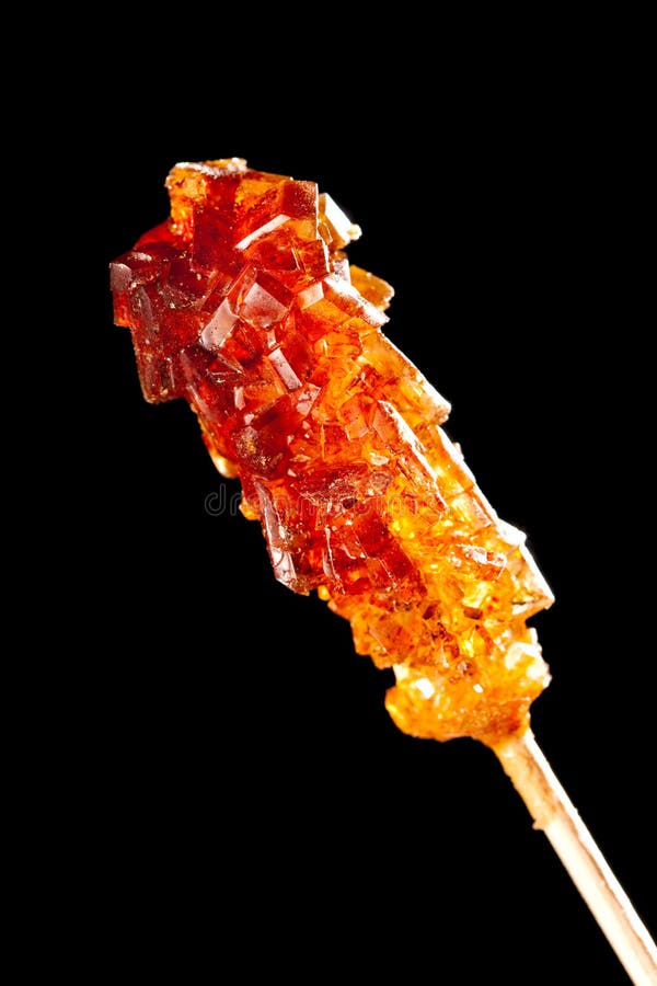Candy Brown Sugar on a Stick Lies on White Sugar Stock Image Image of