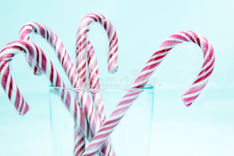 Candy Canes Isolated On Light Blue Picture. Image 5354927