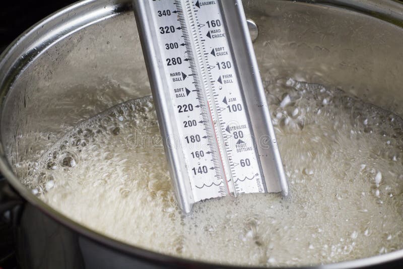 Measuring The Temperature Of Sugar Boiling Or Caramel Syrop Through The  Various Candy Stages Stock Photo - Download Image Now - iStock