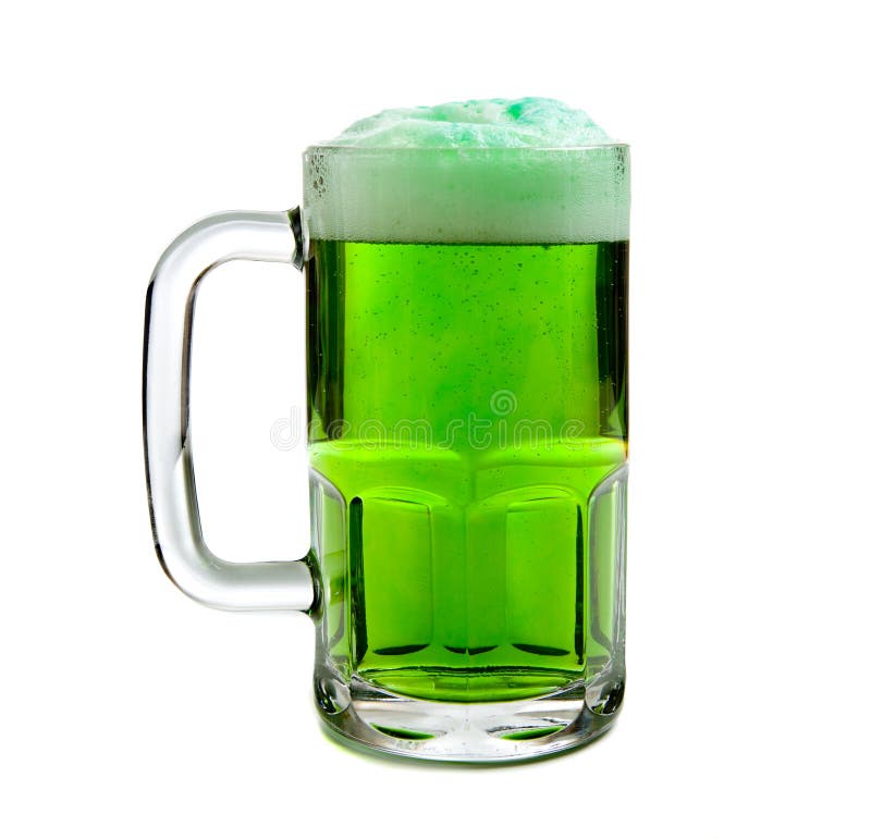 A beer mug of green beer with a foamy head on a white background - St. Patricks Day themd. A beer mug of green beer with a foamy head on a white background - St. Patricks Day themd