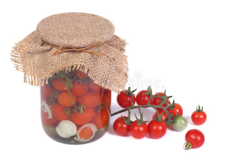 Canned Cherry Tomatoes in a Glass Jar and Fresh Tomatoes Stock Image
