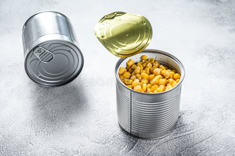 Canned Corn in a Tin Can. Canned Food. White Background. Top View Stock