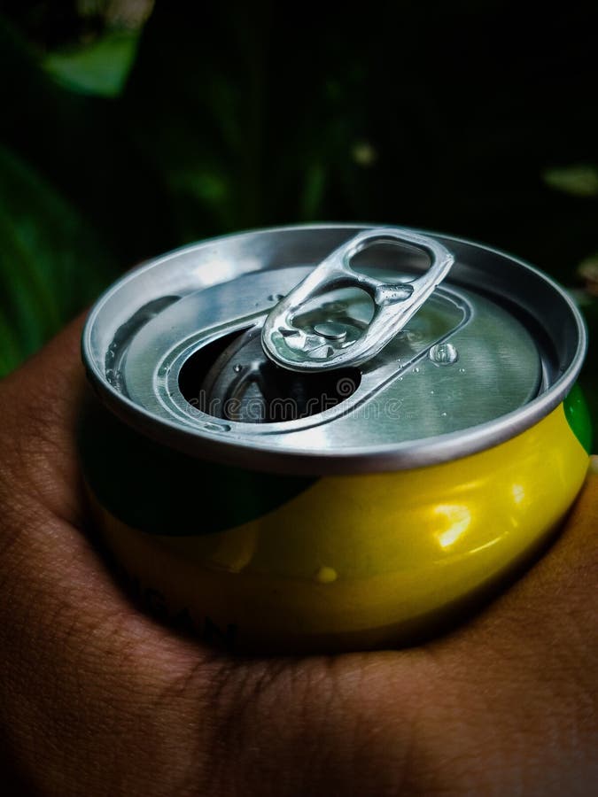 Canned food lid with a bottle opener. Hook metal can top for easy opening  Stock Photo by ©cukugede 395134740
