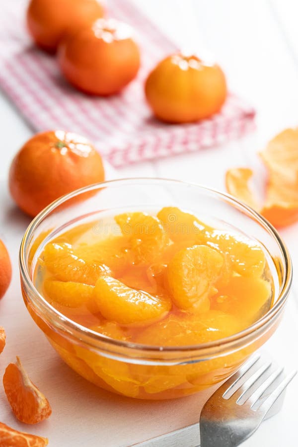 Canned Tangerine. Pickled Mandarin Fruit in Bowl on White Table Stock