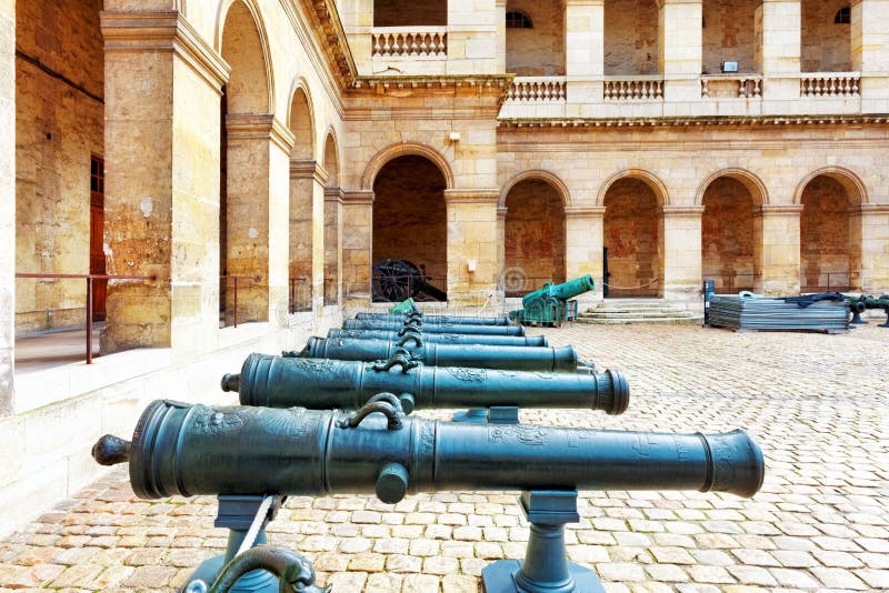 Cannons (guns) in courtyard of Les Invalides hotel . Paris, Fran stock photography Cannons (guns) in courtyard of Les Invalides hotel . Paris, Fran stock photography