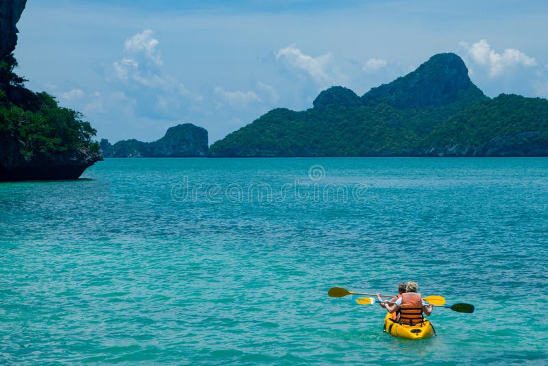 Canoeing in the blue ocean stock image. Image of canoe 116978831
