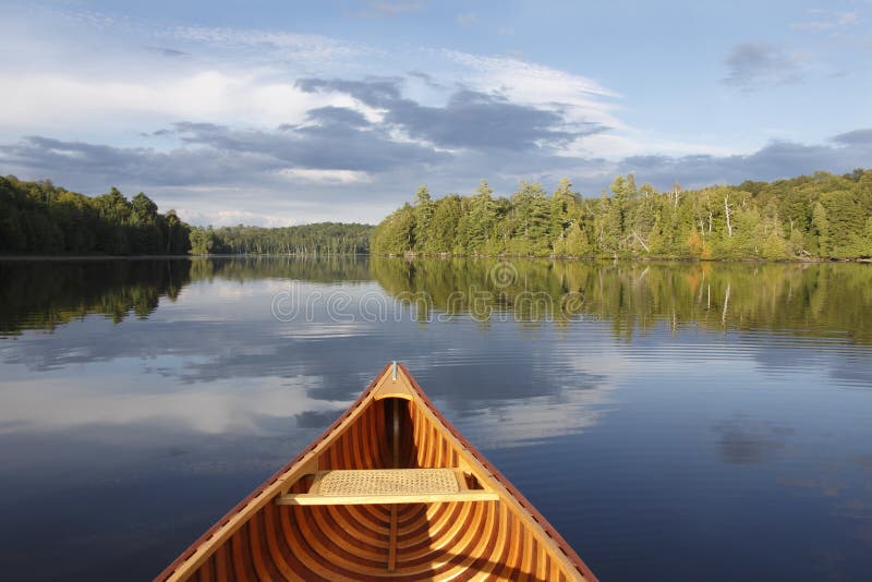 Canoeing On A Tranquil Lake Royalty Free Stock Photography 