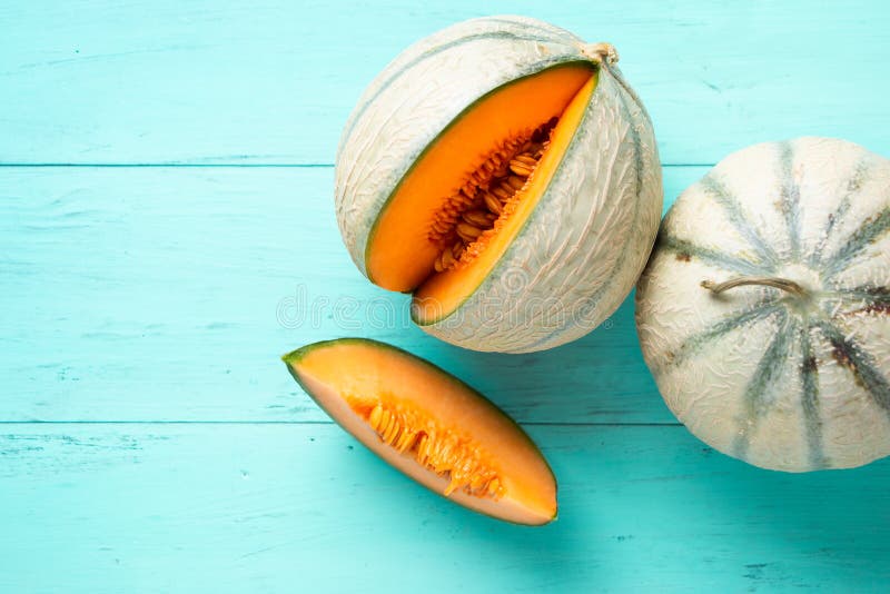 Cantaloupe melons on aquamarine background royalty free stock images Cantaloupe melons on aquamarine background royalty free stock images