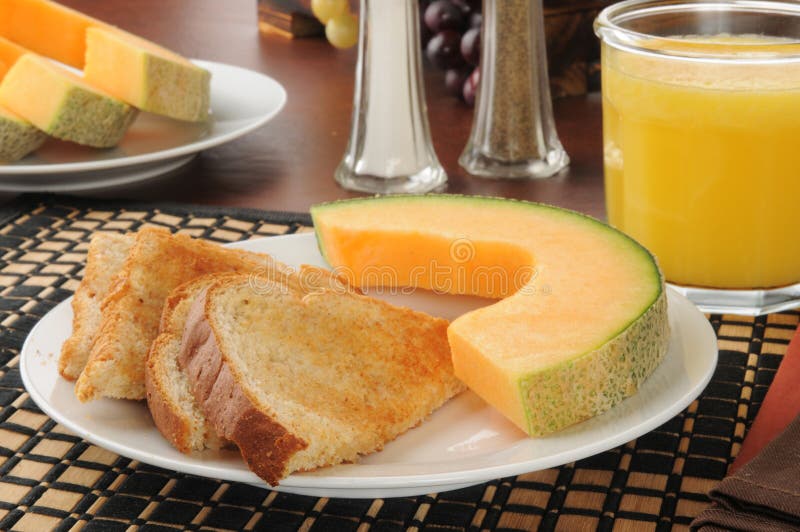 Cantaloupe and toast stock images