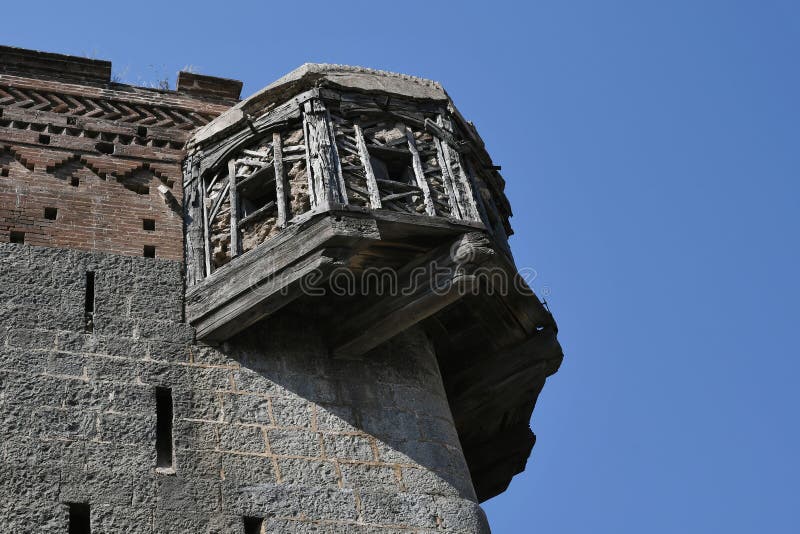 Cantilevered wooden Balcony as watch window on the corner of fortification wall of Sardar Purandare Wada, Saswad, Pune royalty free stock photo Cantilevered wooden Balcony as watch window on the corner of fortification wall of Sardar Purandare Wada, Saswad, Pune royalty free stock photo