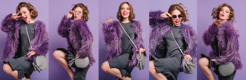 Canto de chica con atuendo de invierno de moda bailando con bolsa gris posando sobre fondo morado. retrato interior de imagen de archivo