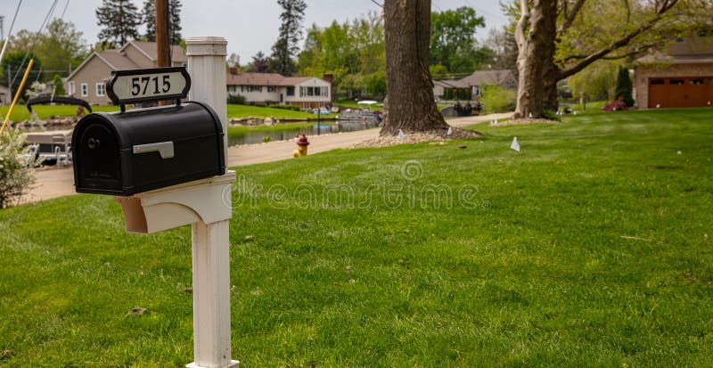 Canton, Ohio lake, USA. May 7, 2019. Mailbox on green grass and trees background in a spring day. Canton, Ohio lake, USA. May 7, 2019. Mailbox on green grass and trees background in a spring day