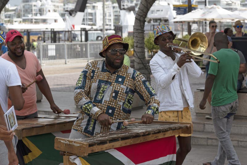 Cape Town, South Africa. December 2019. Street musician  plays xylophone on the waterfront area of central Cape Town. Cape Town, South Africa. December 2019. Street musician  plays xylophone on the waterfront area of central Cape Town
