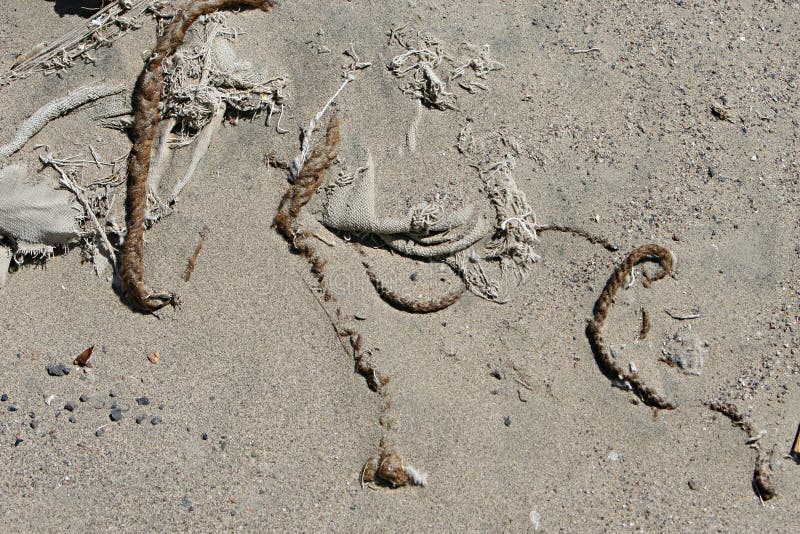 Capelli intrecciati nella sabbia