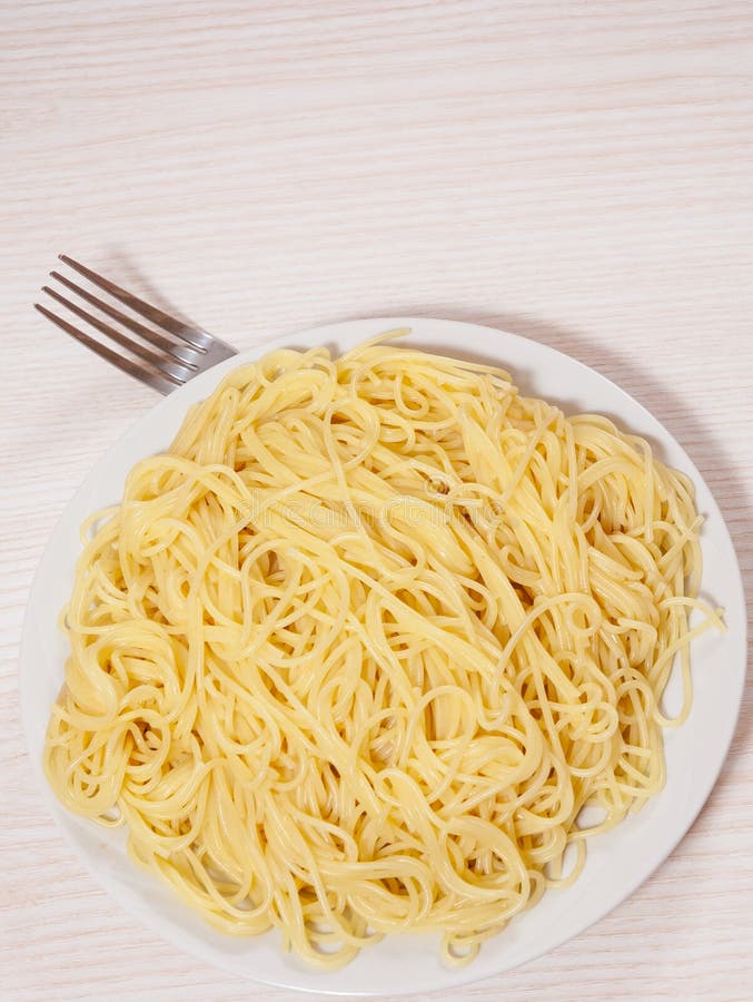 Capellini pasta on plate stock photo. Image of cooking 63890154