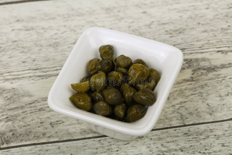 Capers in the bowl stock images