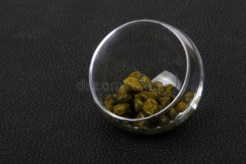 Capers in the bowl stock photos