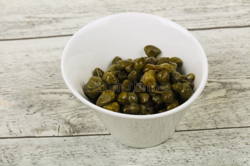 Capers in the bowl stock photos