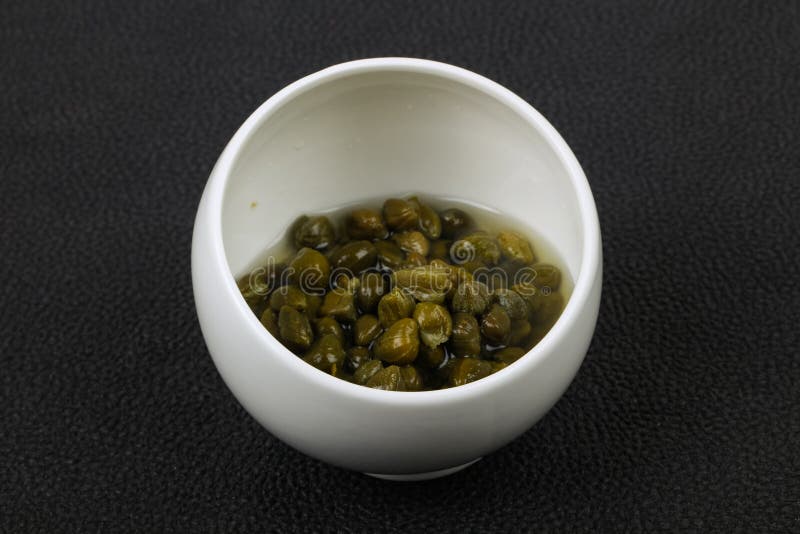 Capers in the bowl stock images