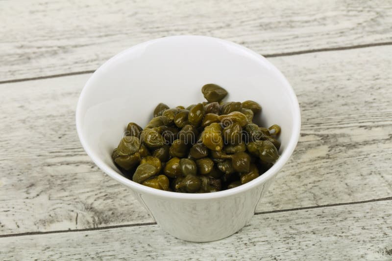 Capers in the bowl stock photos