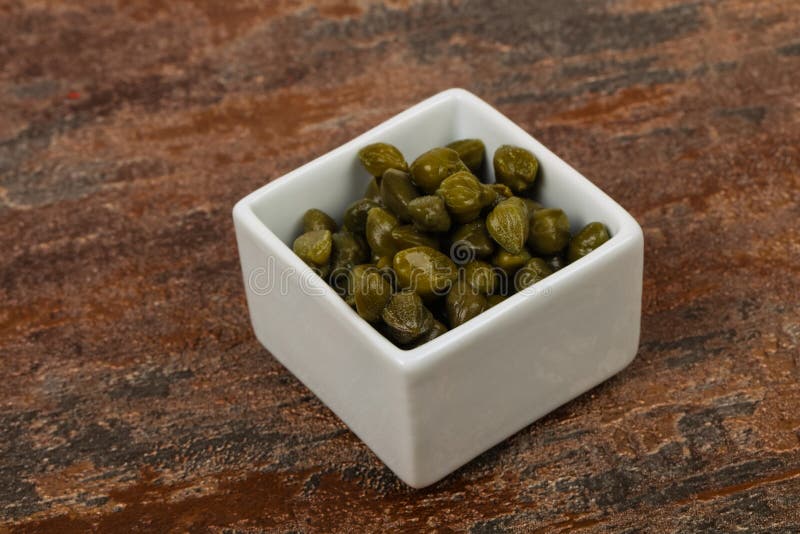 Capers in the bowl stock photos