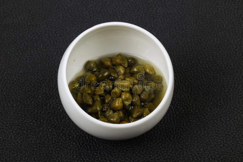 Capers in the bowl royalty free stock photography