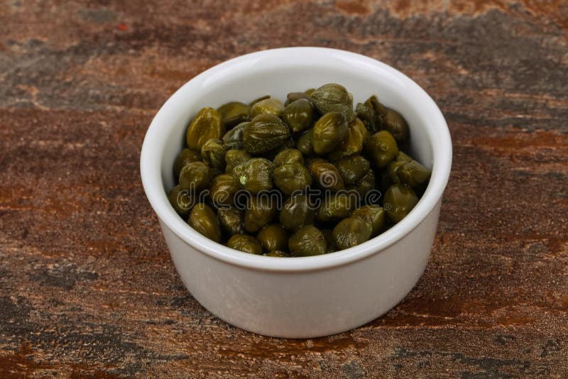 Capers in the bowl stock image