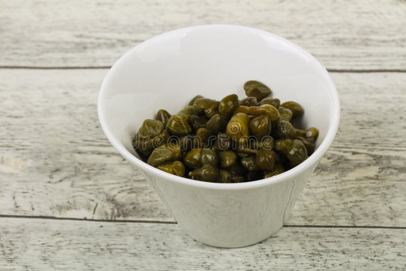 Capers in the bowl royalty free stock photography