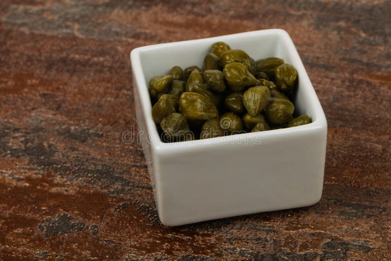 Capers in the bowl royalty free stock image