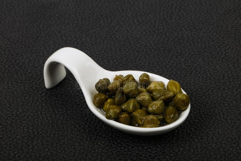 Capers in the bowl royalty free stock photography
