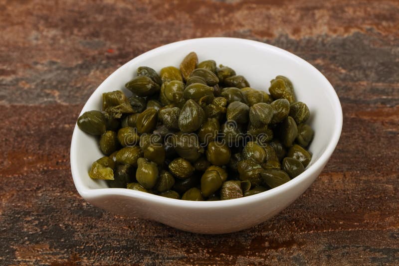 Capers in the bowl stock photography