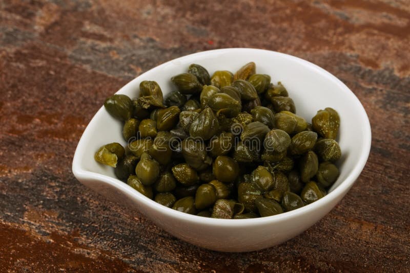 Capers in the bowl stock images