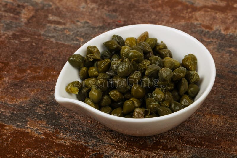 Capers in the bowl stock photo