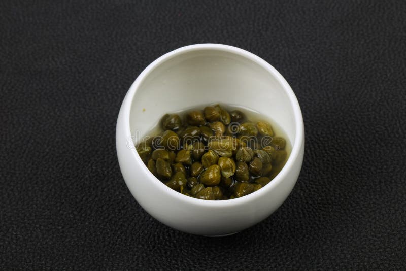 Capers in the bowl royalty free stock photos