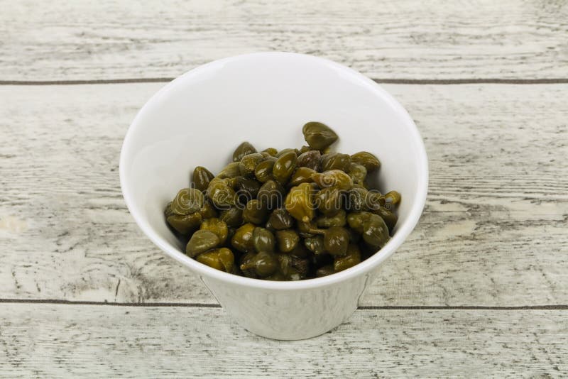 Capers in the bowl stock photos