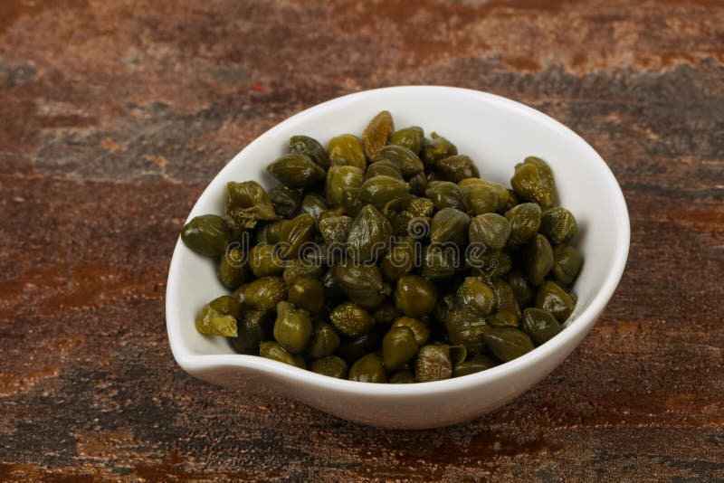 Capers in the bowl stock images