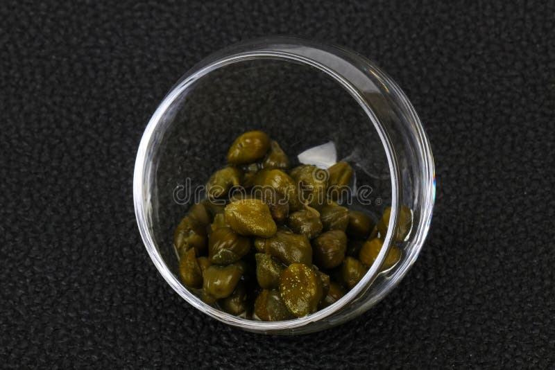 Capers in the bowl royalty free stock photography