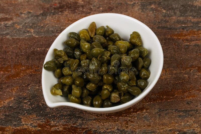 Capers in the bowl stock image