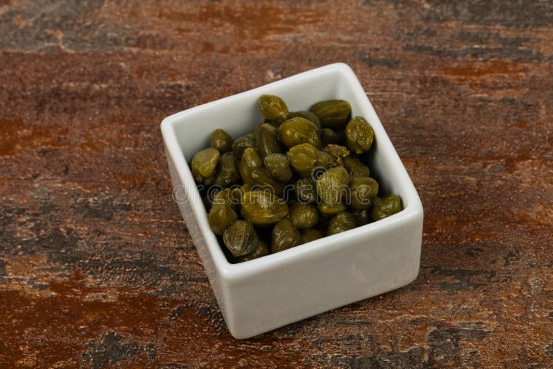 Capers in the bowl stock image