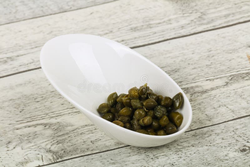 Capers in the bowl stock image