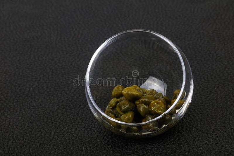 Capers in the bowl royalty free stock photos