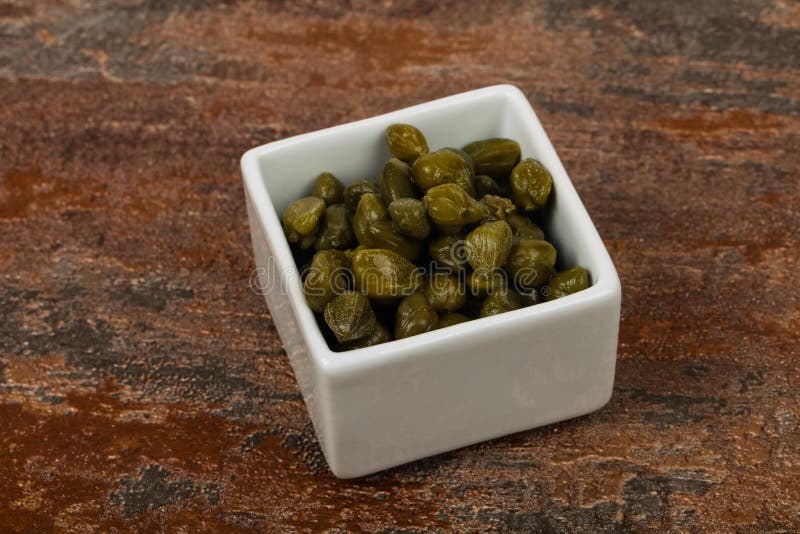 Capers in the bowl stock photography